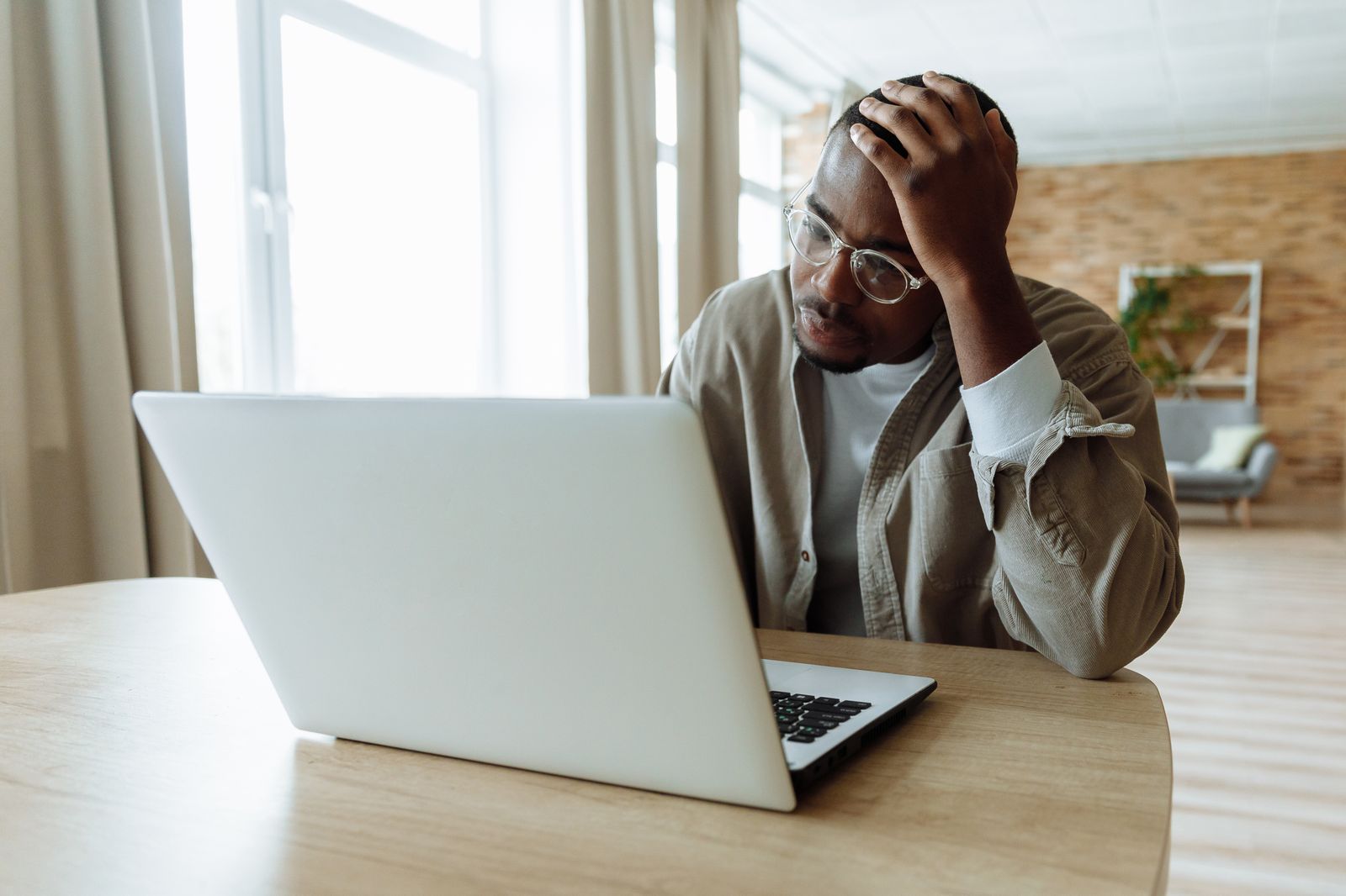 Frustrated business owner looking at a laptop after a website form stopped working